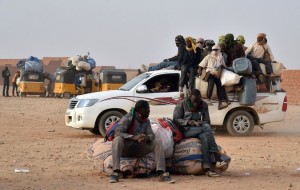 African migrants waiting to board vehicle to Libya and then Europe. Photo New York Times