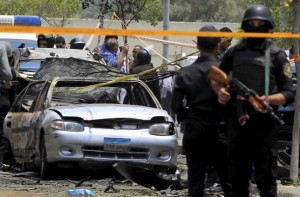 File photo: Policemen secure the site of a car bomb attack in Cairo