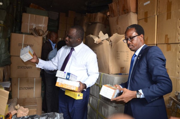 File Photo: NAFDAC officials examine fake products