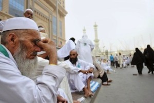 File photo: Muslim pilgrims wait to perform evening prayers