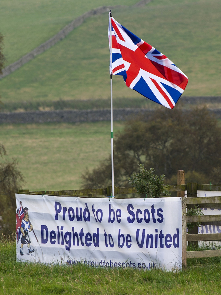 A pro-union banner and the British Union flag are pictured in a field near the Scottish borders, on September 11, 2014. Voters in Scotland and Wales will on Thursday be heading to the polls in highly-anticipated parliamentary elections which could determine the future of Britain’s union.