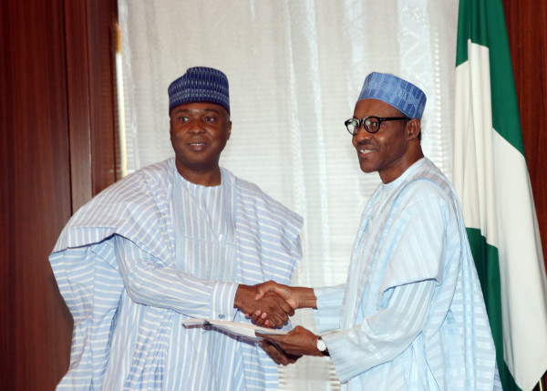 Buhari receives the confirmation report from Senate President, Bukola Saraki