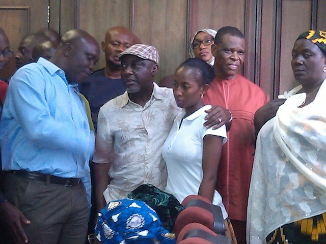 Moro, in cap, in court today, holding his daughter. Photo: Femi Ipaye