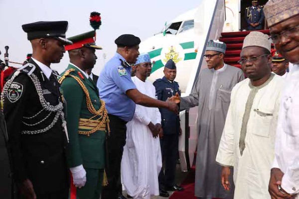 Police IG Solomon Arase was at the mouth of the plane ti welcome Buhari home
