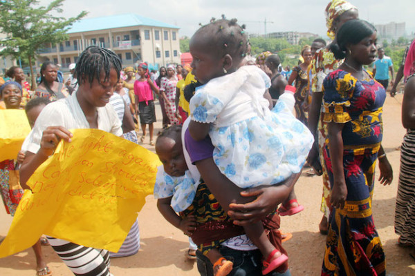 Mother and child also paid to join the protesting crowd