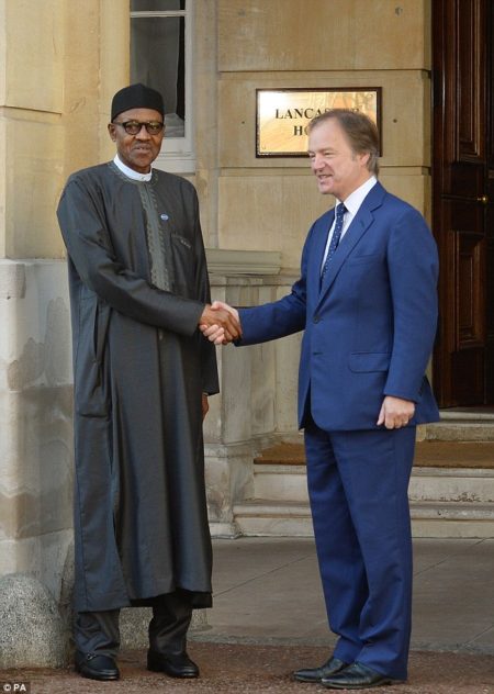 Buhari arrives at Lancaster House, recieved by Foreign Office minister Hugo Swire