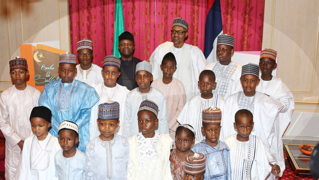 Buhari, Vice President Osinbajo with a section of children when Abuja residents felicitates with the President on Eid=el-Fitr celebration
