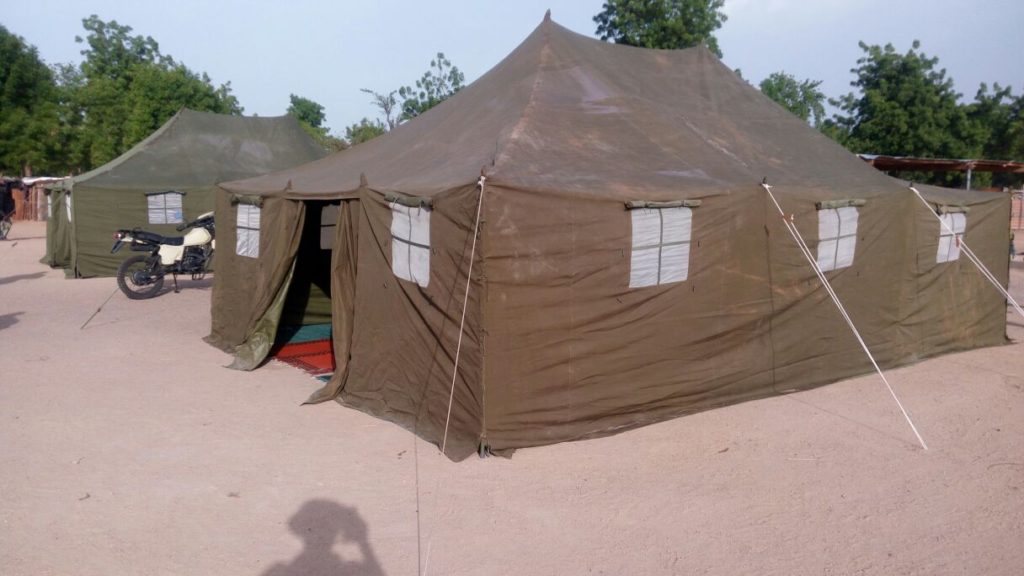 The tents being provided by soldiers to be used as classrooms