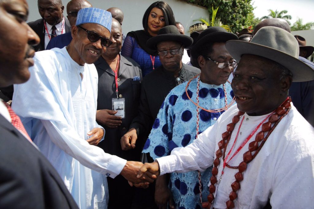 President Buhari shakes elder statesman, Edwin Clark after the meeting