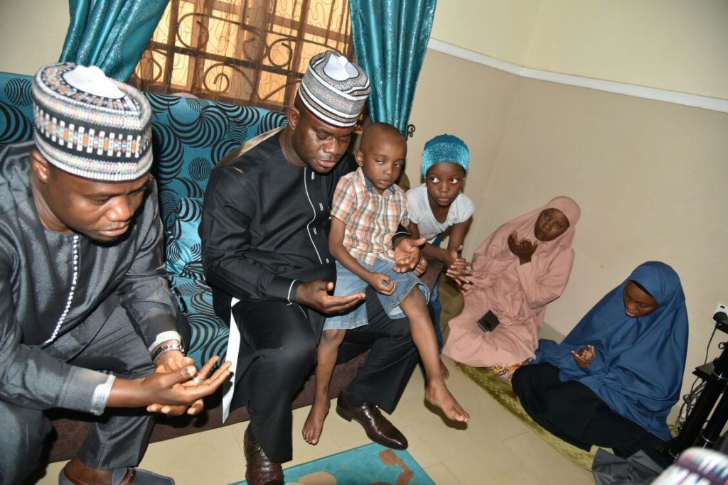 Gov. Bello with the three children of late Lt. Col. Ali and Samira (right) wife of the deceased war hero