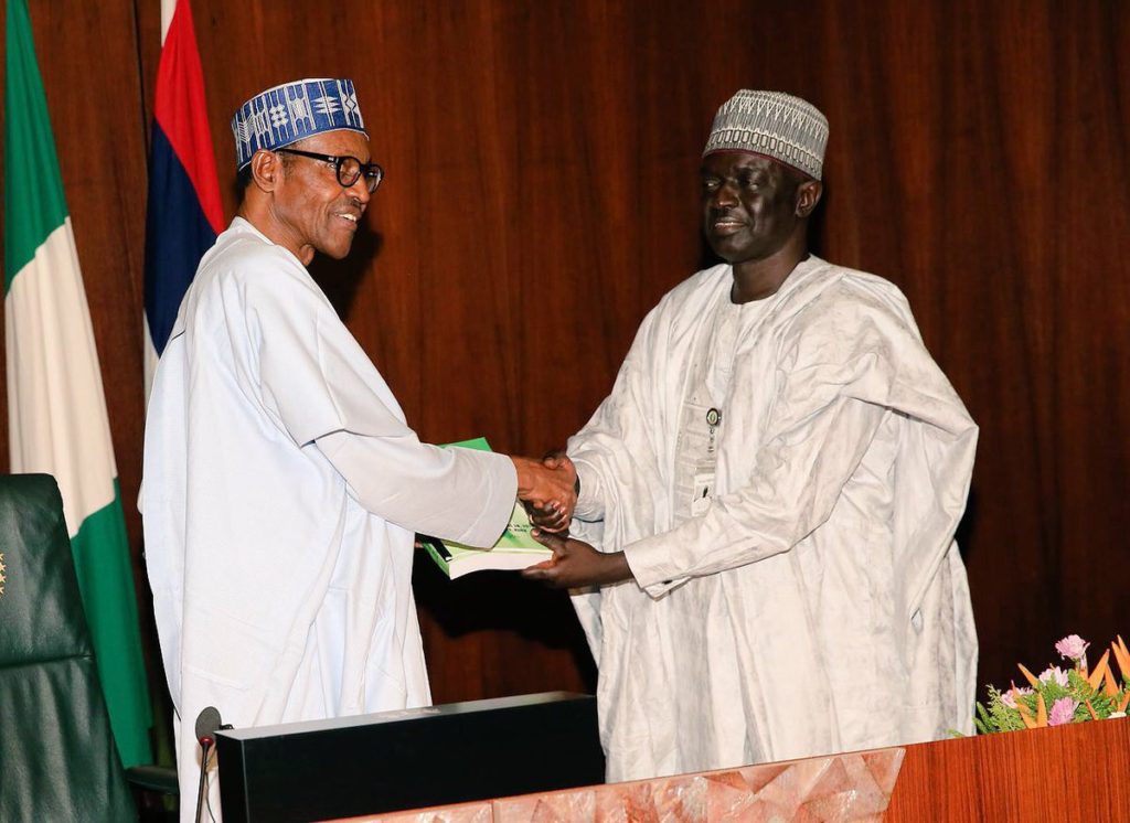 President Buhari today, receiving the report from Acting DG of the National Institute for Policy and Strategic Studies, Mr. Jonathan Juma.