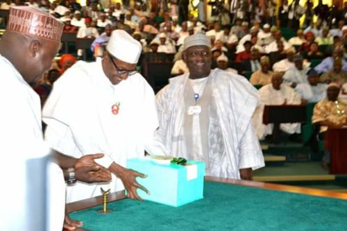 President Buhari lay the 2017 Budget document on the table after presenting it to lawmakers (Photo Femi Ipaye)