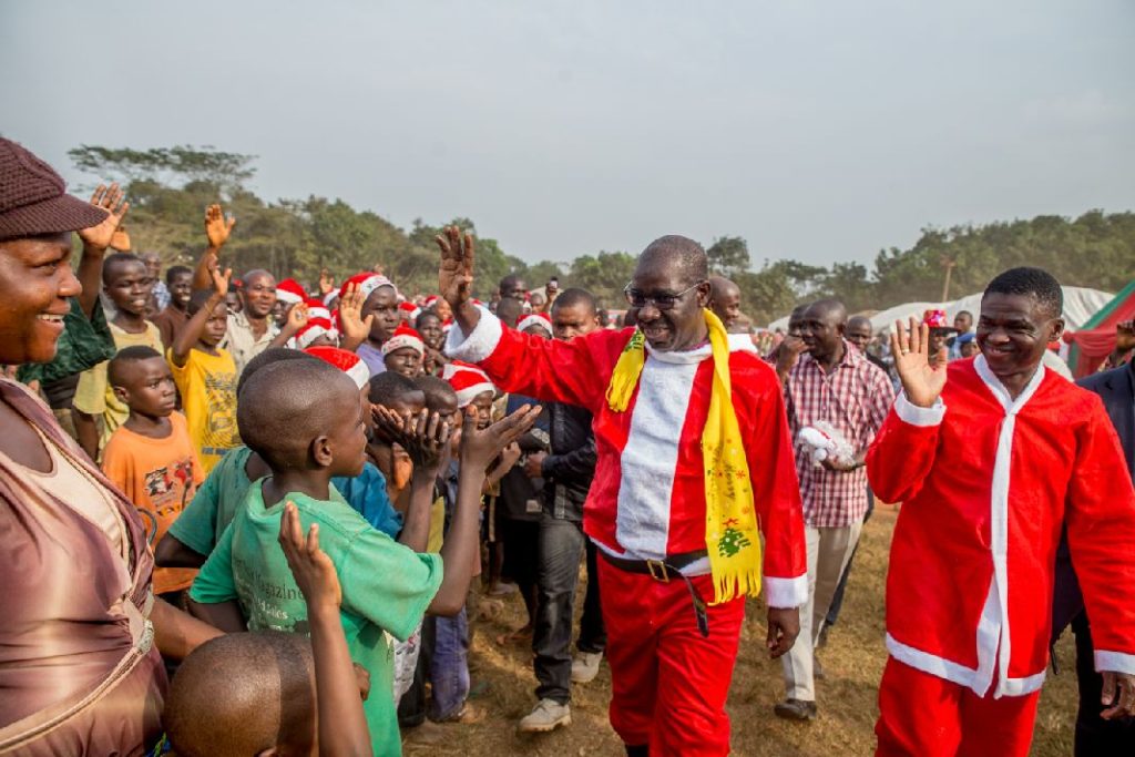 Governor Godwin Obaseki (Left) and Rt. Hon. Comrade Philip Shaibu, Deputy Governor (Right) waving to the children at the IDP children Christmas party