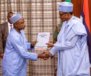 President Buhari receiving Assets Declaration Forms from the Code of Conduct Bureau Chairman, Prof. Mohammed Isah, at the Presidential Villa, Abuja.