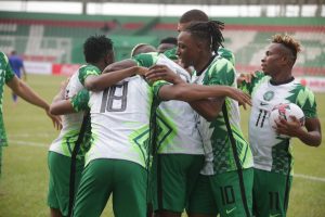 Super Eagles players rejoicing after they scored one of their goals