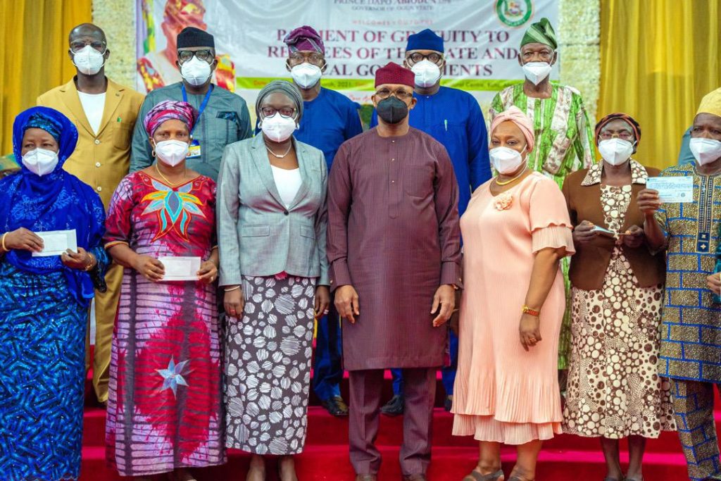 Governor Abiodun and some of the pensioners with their cheques