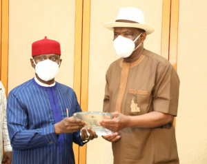 Governor of Rivers State, Nyesom Ezenwo Wike (right) receives a plaque from the Minister of State for Mines and Steel Development, Uchechukwu S. Ogah, during the latter's courtesy visit to Government House, Port Harcourt on Monday.