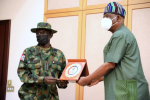 Governor of Rivers State, Nyesom Ezenwo Wike (right) receives a plaque from the Chief of Defence Staff, General Lucky Irabor during the latter's courtesy call at the Government House, Port Harcourt on Friday.