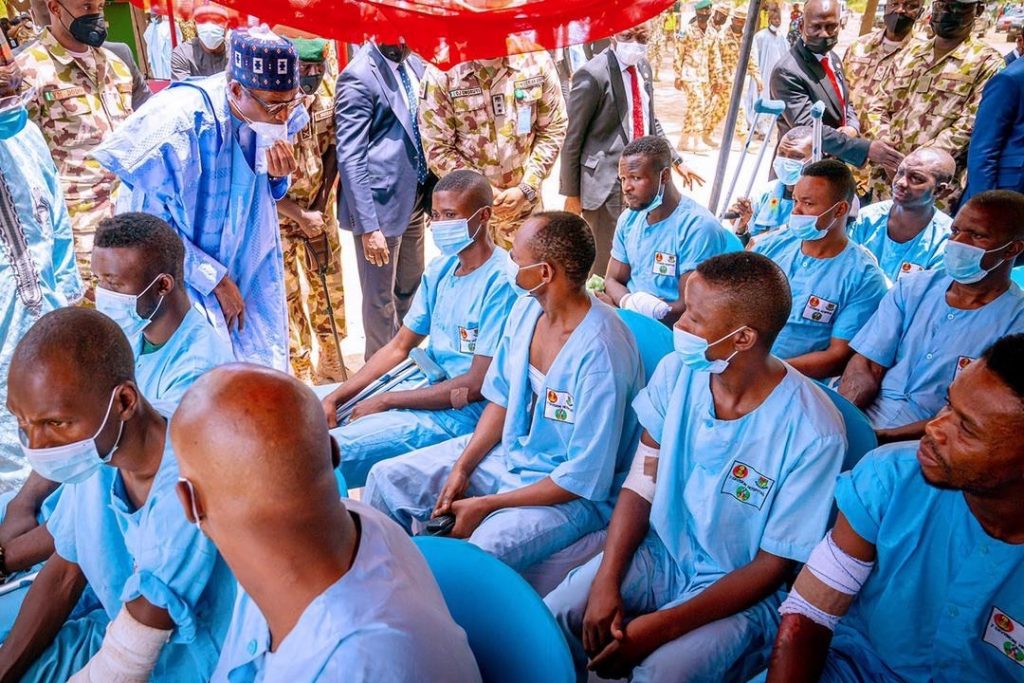 President Buhari visiting some of the injured members of armed forces during the one day trip