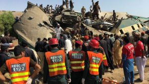Emergency workers in rescue operation at the scene of the train crash in Pakistan