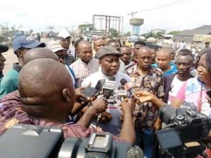 Comrade Celestine Akpobari a humanrights activist and APC Chieftain speaking to Journalists at the venue of the protest.