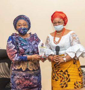 Chairperson of the Ohanaeze Women’s Wing, Lady Patricia Ndubuisi, presenting the plaque for the title of Nne Gburugburu to Mrs Bisi Fayemi in Ado Ekiti on Tuesday