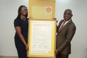 Managing Director, Shell Nigeria Exploration and Production Company Limited SNEPCo, Mrs. Elohor Aiboni receiving the Shell Safety Environment and Social Performance Charter from her predecessor