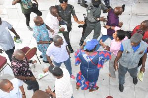 Police officers trying to broker peace between opposing camps during the election
