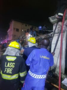 Rescue workers at the site of the collapsed building in Ebute Meta, Lagos
