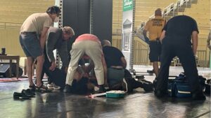 hotos taken show Rushdie lying on his back, with a first responder crouched over him.