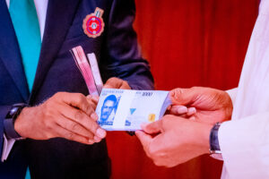 President Buhari unveils new redesigned naira notes