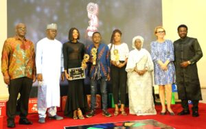 Roland Kayanja, Director UNIC, SOP-OSSAP SDGs, Ahmad Kawu, sister to Precious Emmanuel, some of the winners with the plaques, Senator Aderanti, EU Charge d' Affairs Mrs Agnieszka Torres de Oliviera and Mr Desmond Utomwen of Fresh News Media at the event