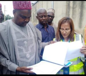 Kano state Commissioner of Health studying the project document with Eleana, UNICEF Project Coordinator