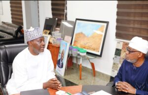 Hon. Minister of Solid Minerals Development, Dr. Oladele Alake, exchanging views with Mr. Samaila Zubairu, President/Chief Executive Officer, Africa Finance Cooperation