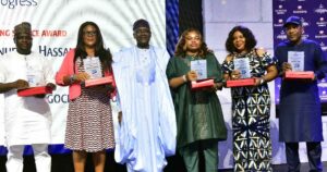 L -R, Group Managing Director, Dangote Industries Limited, Olakunle Alake, 20 years Meritorious and Dedication Service to Dangote Cement plc, Ngwu Ugochukwu Lucy, Chairman Dangote Cement plc, Aliko Dangote, Ukamaka Emmanuel, 20 years Meritorious and Dedication Service to Dangote Cement plc, at the Dangote Cement plc Long Service Awards in Lagos on Friday 8th December 2023