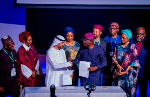 Governor of Lagos State, Mr. Babajide Sanwo-Olu in a warm handshake with Chairman of Nigerian-Arabian Gulf Chamber of Commerce (NAGCC), Sheikh Abdul Rahman Saif Bin Saif Al Sharqi during the signing Memorandum of Understanding (MoU) on bilateral trade and investment forum between Lagos and NAGCC member countries, at the JAFZA One Convention Centre in Dubai, United Arab Emirates (UAE), on Sunday, 04 December 2023. With them: Lagos Commissioner for Economic Planning and Budget, Mr. Ope George (right); his counterpart for the Environment and Water Resources, Hon. Tokunbo Wahab (right behind); Chairman, Online Integrated Solutions Ltd (OIS), Mahmood Ahmadu (left).