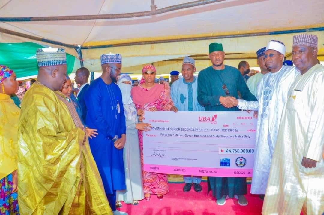 Governor Radda disbursing a cheque to one of the schools' management