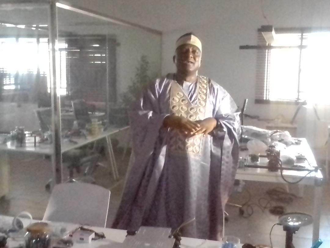 The Vice Chancellor , Prof. Abdullahi Bala, showcases some equipment at the Robotics laboratory
