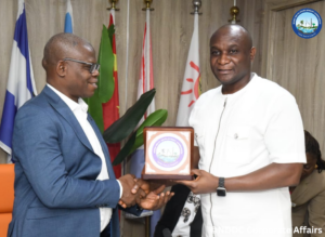 The NDDC Managing Director, Dr Samuel Ogbuku (right) presenting a plaque to Vice Chancellor of the Niger Delta University, NDU, Bayelsa State, Professor Allen Agih (left) during a courtesy visit by a delegation from the university at the Commission’s headquarters in Port Harcourt