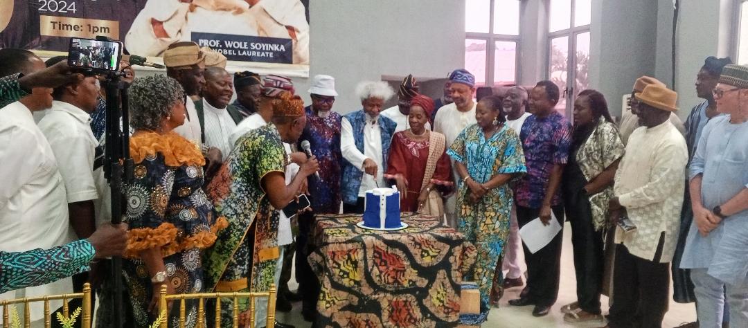 Professor Wole Soyinka cutting his birthday cake
