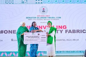 L-R Wife of the Vice President and National Vice Chairman, RHI, Hajia Nana Shettima, winner of the #One Nigeria/Unity Fabric Competition Bamidele Mofiyinfoluwa Peace, First Lady of Nigeria, Senator Oluremi Tinubu during the presentation of the prize money and unveiling of the #One Nigeria/Unity fabric at the banquet hall, State House, Abuja on Monday 16th September,2024