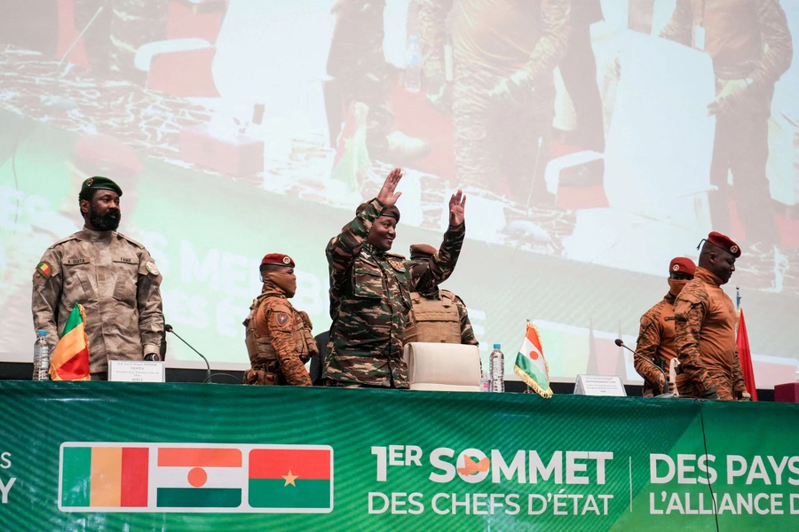 Niger’s junta leader Gen. Abdourahamane Tchiani reacts as Mali’s Assimi Goïta and Burkina Faso’s Capt. Ibrahim Traoré stand during the first ordinary summit of heads of state and governments of the AES on July 6, 2024 in Niamey, Niger. Mahamadou Hamidou/REUTERS