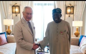 President Bola Tinubu, right