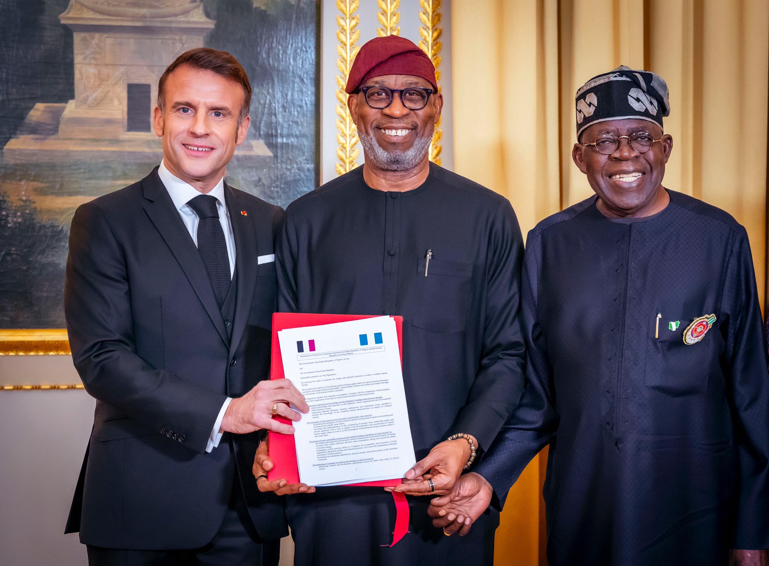 R-L: President Bola Tinubu; Solid Minerals Development Minister, Dr. Dele Alake and President of France, Emmanuel Macron displaying the Memorandum of Understanding (MOU) on Solid Minerals Development between both countries during President Tinubu's official visit to France. 1st December, 2024.