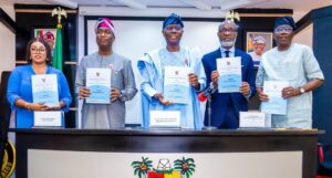 Special Adviser to the Governor on Housing, Barr. Barakat Bakare-Odunuga; Deputy Governor of Lagos State, Dr. Obafemi Hamzat; the Governor, Mr. Babajide Sanwo-Olu; Managing Director/Chief Executive Officer, Access Bank, Mr. Roosevelt Ogbonna and Commissioner for Housing, Mr. Moruf Akinderu-Fatai during the signing off event of the Odonla-Odogunyan housing estate project, facilitated by Lagos government and Access bank, held at the Conference room, Lagos House, Ikeja, on Tuesday, 17 December 2024.