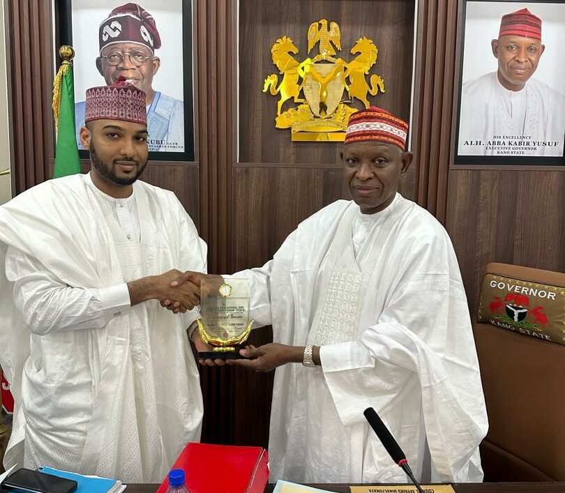 Governor Yusuf receiving the Award from YEDFO