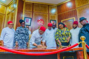 L-R: Secretary to State Government, Chief Cosmos Iwu, Deputy Governor, Lady Chinyere Ekomaru, Governor Hope Uzodimma, Speaker Imo State House of Assembly, Rt. Hon. Chike Olemgbe, Hon. Thaddeus Chisom Ojukwu representing Nkwerre State Constituency, Clerk of the House/Head, Legislative Service, Barr. Chinelo Emeghara, Deputy Speaker, Rt. Hon Amara Iwuanyanwu, and Majority Leader, Rt. Hon. Kanayo Onyemaechi during the signing of the 2025 appropriation bill into law at Government House Owerri... Monday.