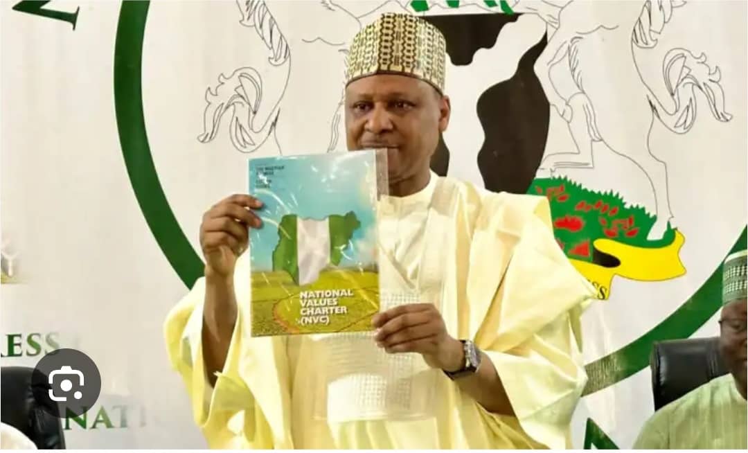 The Information Minister Idris with a copy of The National Value Charter