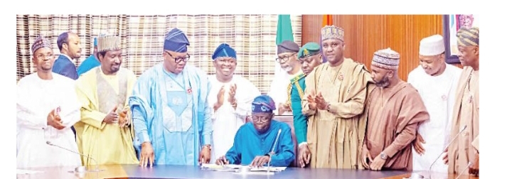 President Tinubu signing the budget