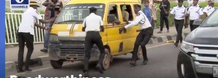 VIS officials and a commercial bus in Lagos. Photo credit: Channels